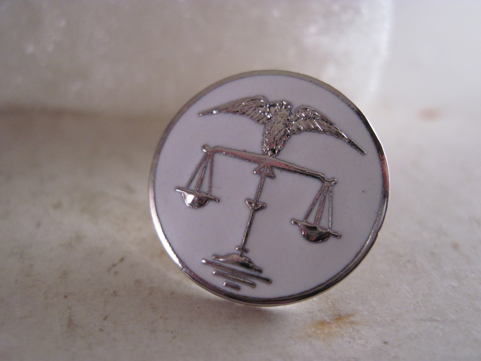 Scales of Justice logo lapel pin white silvertone
